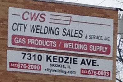 exterior bricks with sign on the wall